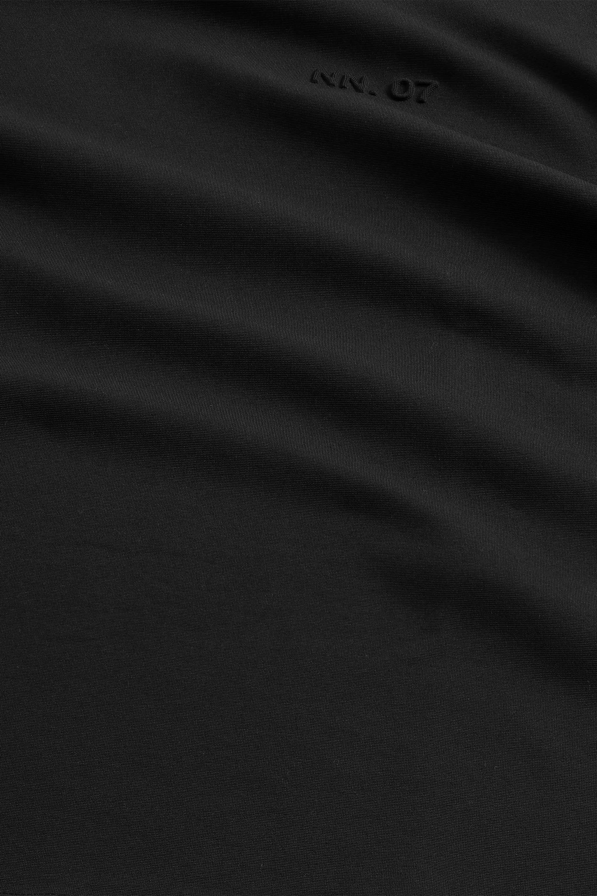 Black fabric with a brand logo in the corner